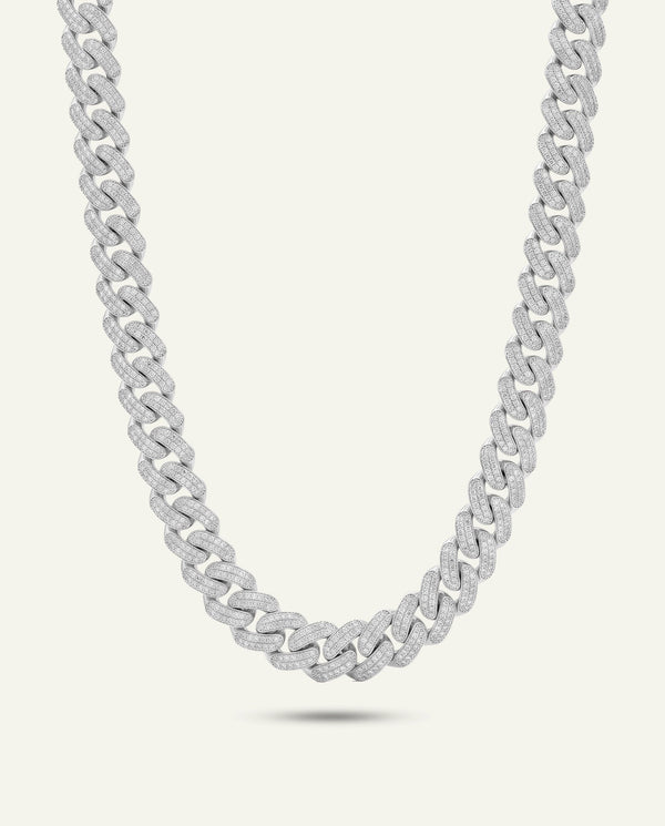 A silver-toned diamond-paved Cuban link chain necklace displayed in a U-shape against a plain off-white background.