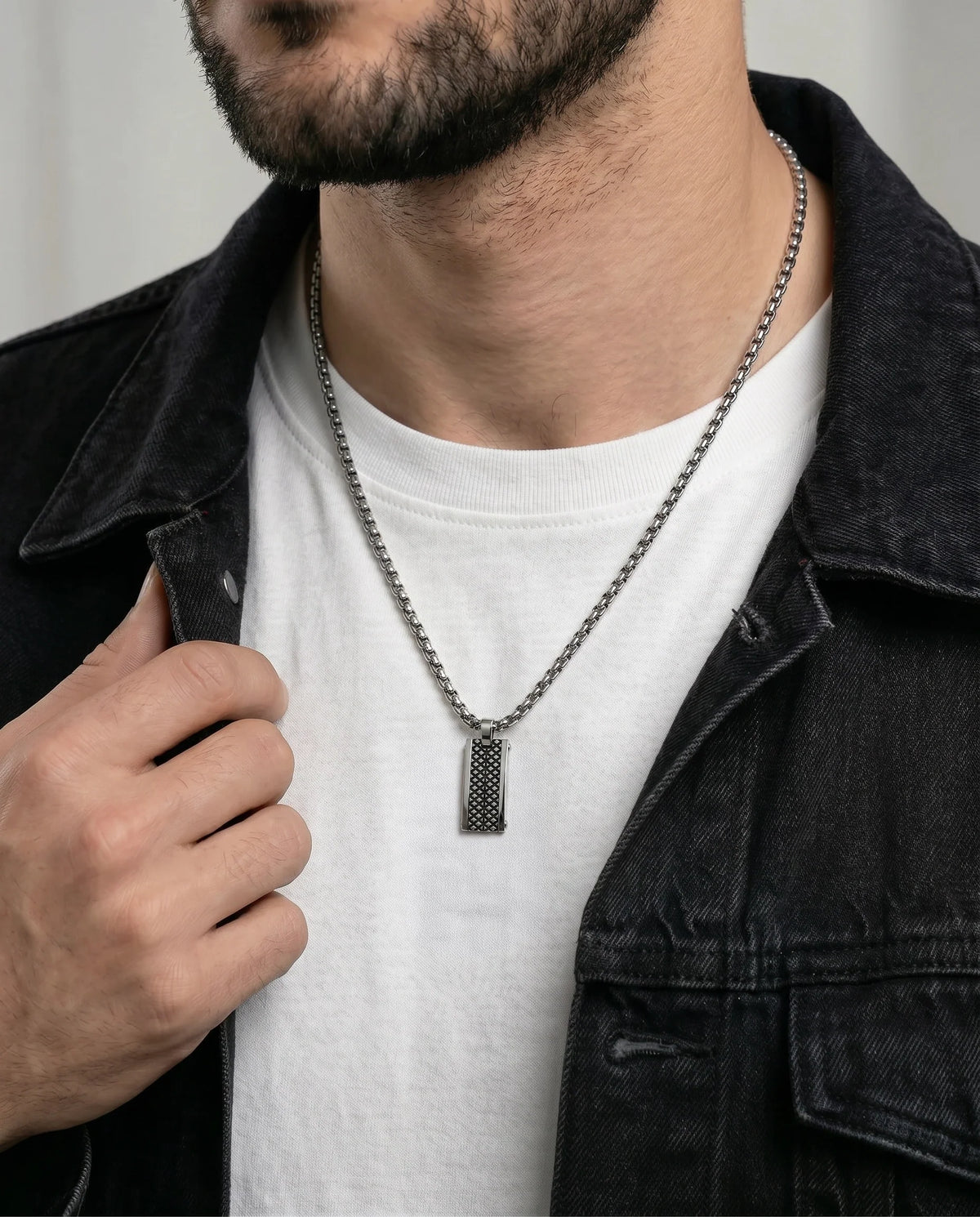 Close-up of modern dog tag pendant