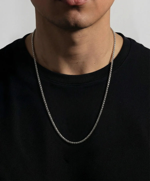 men's silver-toned stainless steel box chain necklace on model wearing black t-shirt