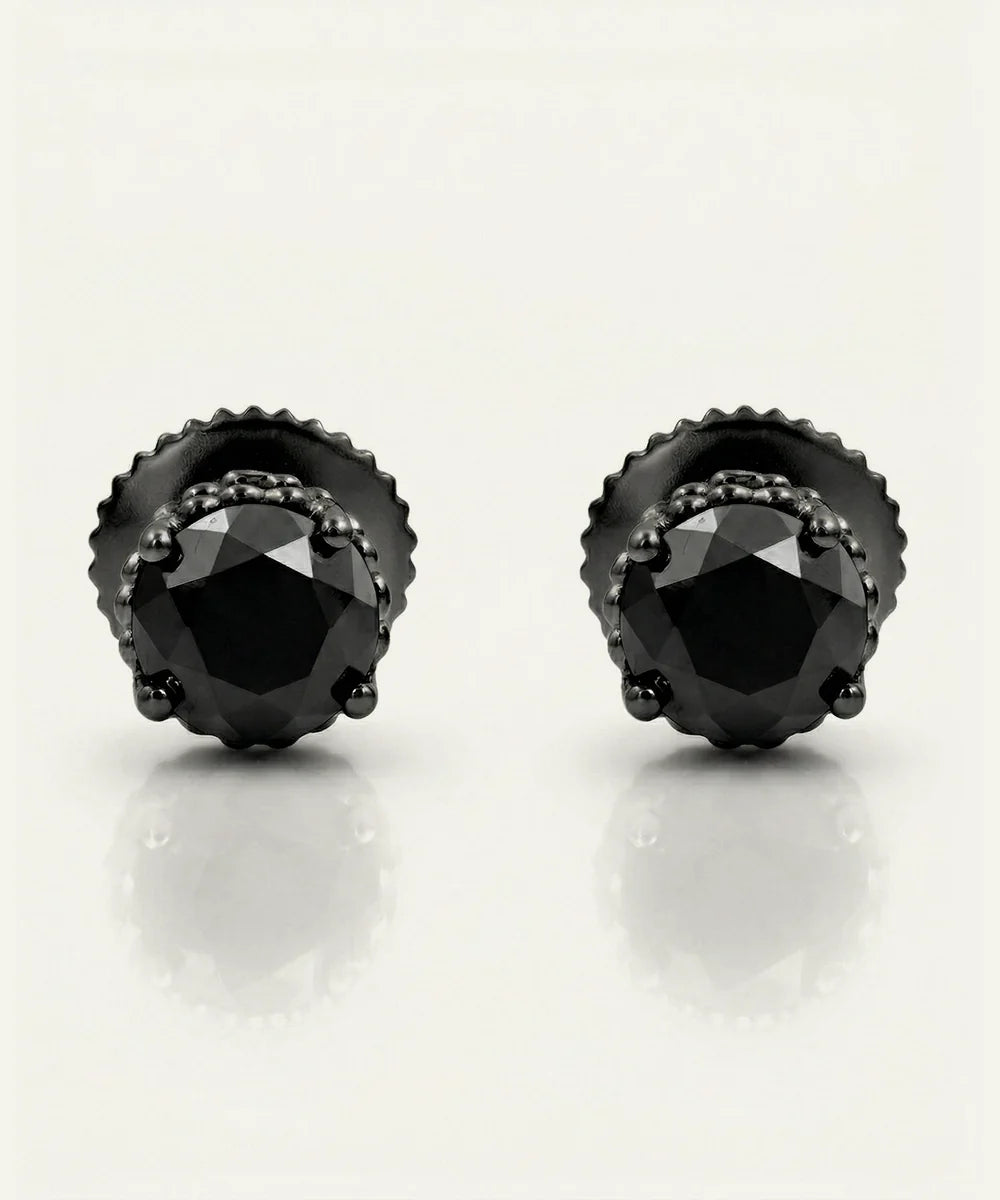 Close-up of round black diamond stud earrings for men