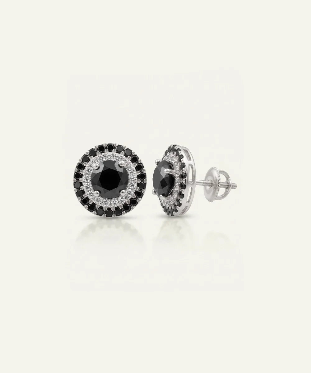 Close-up of men's black diamond cluster earrings in silver finish