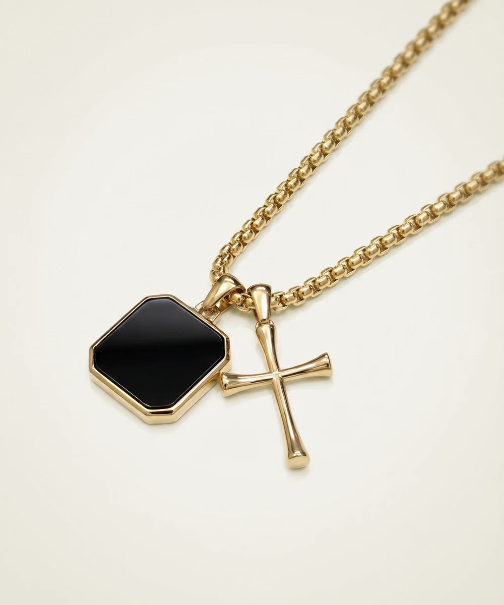 men's black cross pendant from Valliani Jewelers