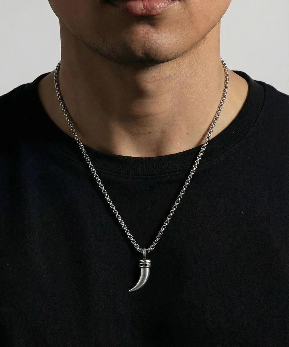Close-up of talon pendant