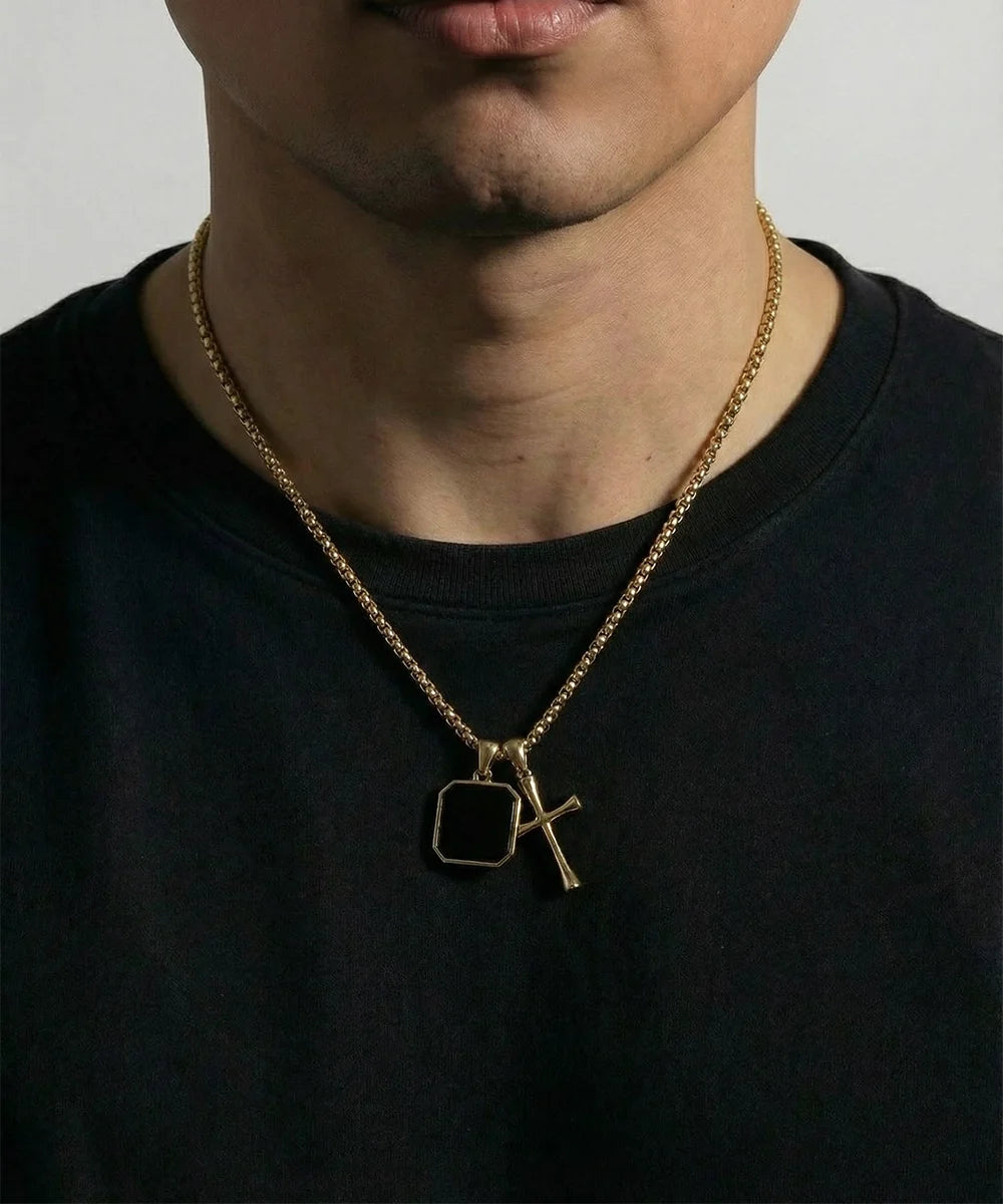 Close-up of black acrylic cross pendant