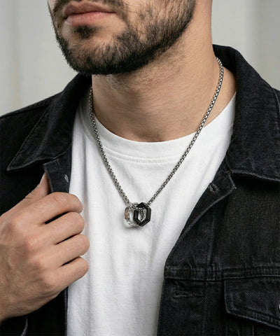 Close-up of textured rings pendant - alternate view