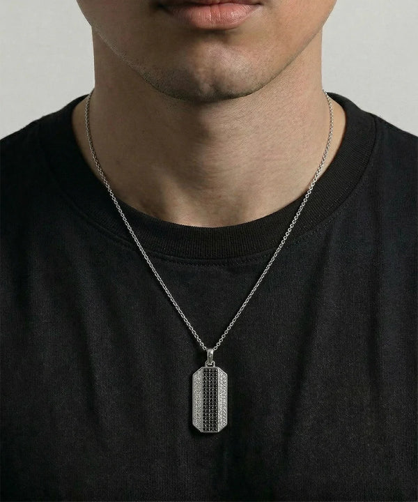 Close-up of diamond dog tag pendant